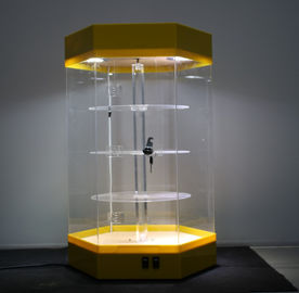 Porcellana Bella base acrilica rotabile di giallo dello scaffale dei banchi di mostra chiudibile a chiave con luce principale fornitore